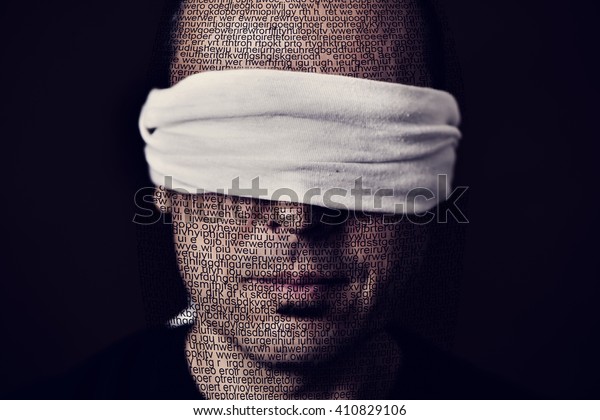 closeup of a young man patterned with no-sense\
words with a blindfold in his eyes, depicting the idea of lack of\
press freedom
