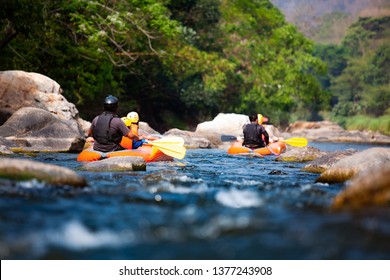 Close-up of young people rafting on the river turbulent flow. Extreme and enjoyment sport. - Powered by Shutterstock