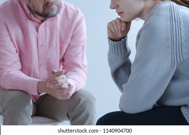 Close-up Of A Young Sad Woman Sharing Her Grief With A Psychotherapy Specialist During An Individual Counseling Meeting.
