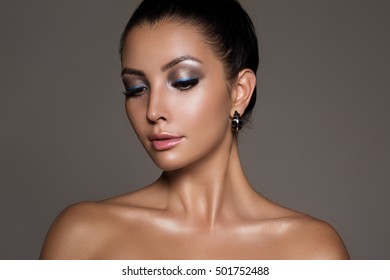 Close-up of young woman with beautiful make-up and glamour gloss lips 