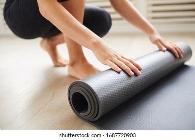 Close-up of young woman with exercise mat preparing for sports training - Powered by Shutterstock