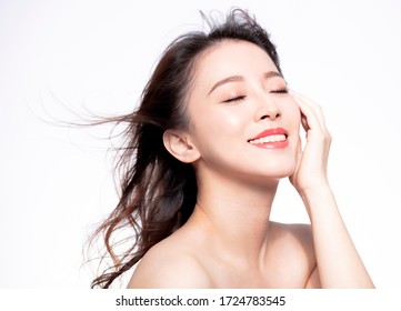 closeup young Woman face with hair motion on white background