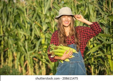 Closeup Of Young Woman Farmer At Corn Harvest