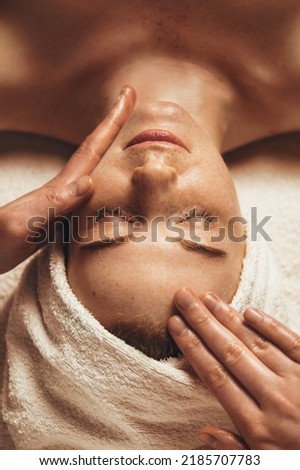 Close-up of young woman getting spa massage treatment at beauty spa salon. Spa beauty treatment concept. Body skin care