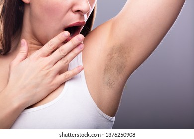 Close-up Of A Young Woman With Hairy Armpit