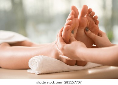 Close-up Of Young Woman Having Reflexology