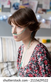 Close-up Of Young Woman With Oxygen Tube In Her Nose Having A Serious Disease, She Sitting At Hospital Ward