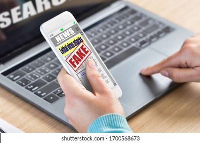 Closeup Of Young Woman Reading Digital Fake News On Laptop. Propaganda And Disinformation Online. Media And Digital Concept.