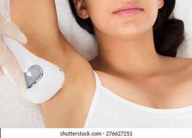 Close-up Of Young Woman Receiving Epilation Laser Treatment On Armpit