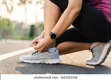 closeup of young woman runner tying her shoelaces. healthy and fitness concept. - Shutterstock ID 1655321536