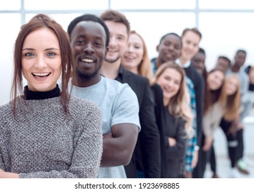 close-up . young woman standing in front of a group of young people