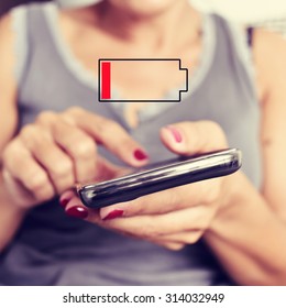 Closeup Of A Young Woman Using A Smartphone And An Illustration Of A Low Battery