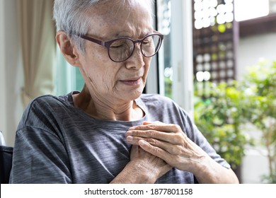 Closeup,Asian Senior Woman Sit In Wheelchair Suffering Chest Pain,suffocation And Chest Tightness Or Panic Disease,old Elderly With Angina Pectoris,asthma Attack,problems With Breathing,respiratory