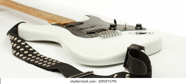 Closeup.electric Guitar With Metal Strap. Isolated On White.