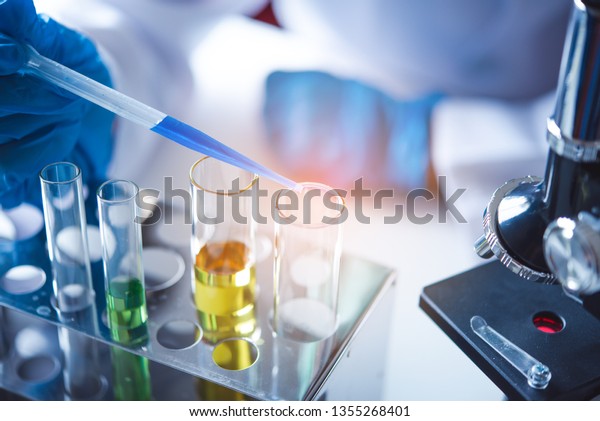 Closeuppipette Dropping Sample Into Test Tube Stock Photo 1355268401 ...