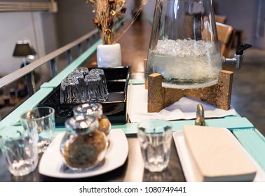 Close-ups Of Beverage Bar Counter Convenience For Customer Such As Iced-water, Sugar, Creamer And Paper Napkin At Coffee Cafe Shop In The Afternoon For Tea Time In Relaxing Moon On Sunday.