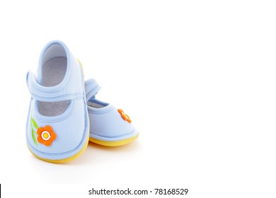 Close-ups Of Blue Baby Shoes On White - Baby Stuff