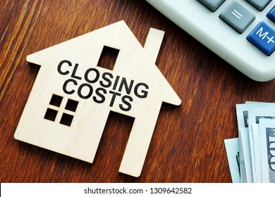 Closing Costs. Model Of House And Money.