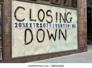 Closing Down Sign In A City Centre Shop.