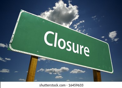 Closure Road Sign with dramatic clouds and sky.