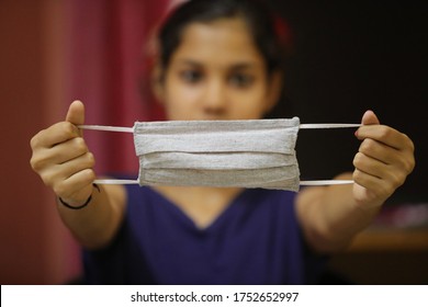 Cloth Facemask For Preventing Coronavirus. Indian Girl Isolated