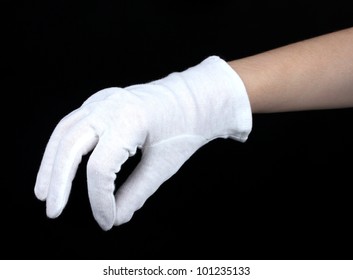 cloth glove on hand on black background