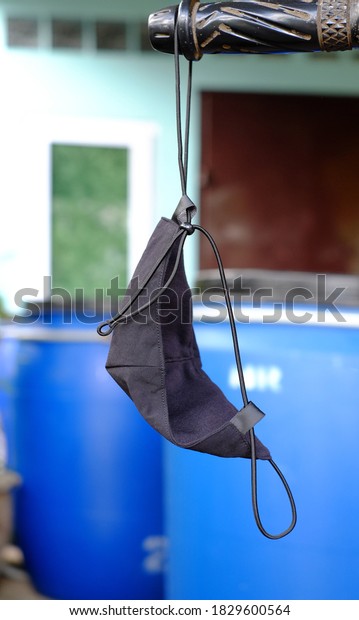 Cloth mask\
hanging on the car and the machine can be washed and dried in the\
shade for reuse. Prevent infection from the epidemic of COVID-19\
black cotton face mask, cloth\
mask.