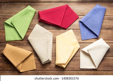 Cloth Napkin On At Rustic Wooden Plank Board Table Background, Top View