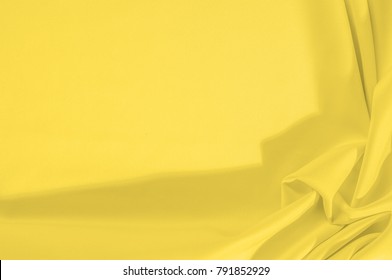 Cloth - silk yellow. This yellow creme silk crepe de  shows a simple elegance. The creamy tone of ivory is textured with wrinkle waves, as it can boast a subtle sheen - Shutterstock ID 791852929