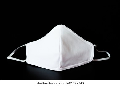 Cloth White Mask Isolated On Black Background - For Prevent Dust (PM 2.5), 
Disease (Coronavirus Or COVID-19).