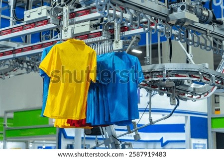 clothes are being conveyed to automatic machine