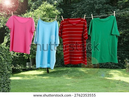 Clothes drying on laundry line outdoors at backyard
