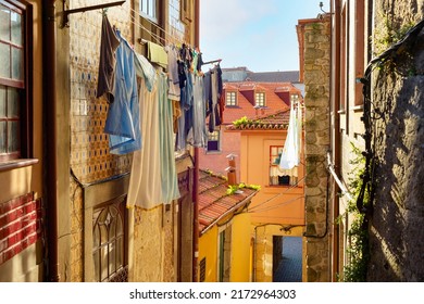 Clothes drying on line, traditional old town street view, colorful houses, Porto, Portugal