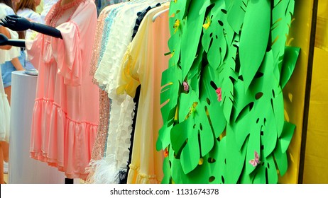 Clothes fashion season on a hanger at a city fair in the summer. - Shutterstock ID 1131674378