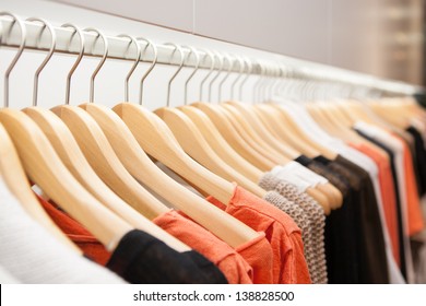 Clothes hang on a shelf in a designer clothes store in Melbourne, Australia - Shutterstock ID 138828500