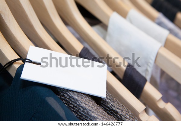 Clothes hang on a shelf in a designer clothes\
store in Melbourne,\
Australia