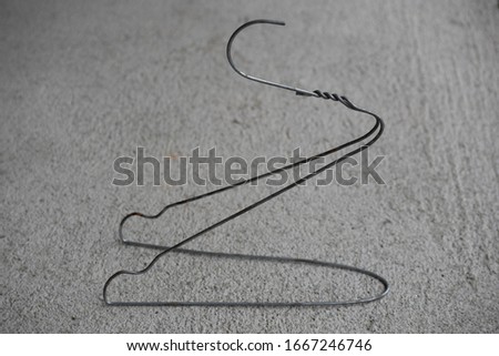 clothes hanger made out of wire bent to the form of a bird