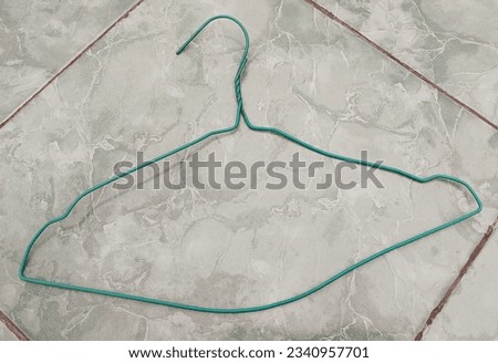 clothes hanger made of wire material that is strong enough so that it is safe to use and durable