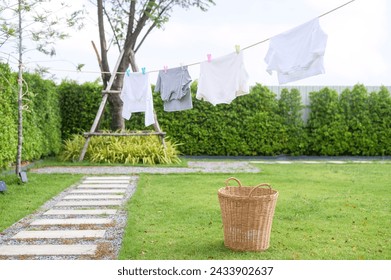 Clothes hanging laundry on washing line for drying against blue sky outdoor - Powered by Shutterstock