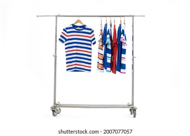 Clothes Hanging On Clothing Rack Wardrobe Fashion Apparel Selection Of Rainbow Striped Color T-shirts On Closet Hanger