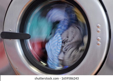 Clothes Inside Washing Machine Of Pubblic Self Service Laundry