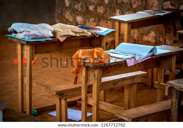 Clothes Left On Wooden School Desks Stock Photo Edit Now 1267712782