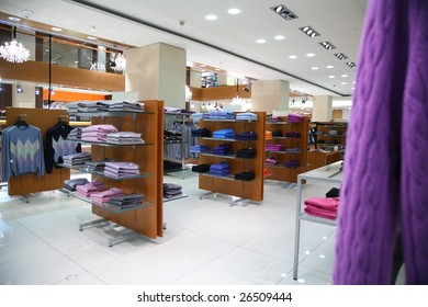 Clothes on shelves in shop