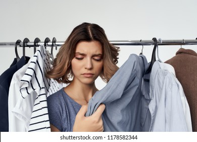 Clothes On The Shoulders Of An Ugly Woman Near The Wardrobe                           