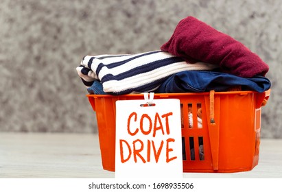 Clothes In Orange Basket Or Box With Coat Drive, Donation Concept