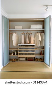 Clothes Organized In Closet