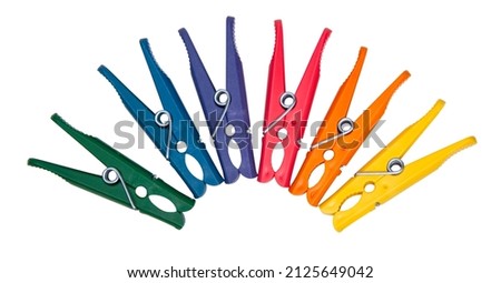 Clothes pegs or pin multicolor for house isolated on the white background