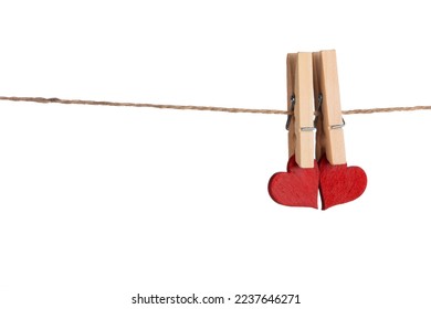 Clothes pegs and two red hearts on rope isolated on white background Valentines day concept - Powered by Shutterstock
