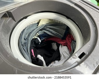 Clothes that have been tumble dried in the washing machine drum. - Shutterstock ID 2188453591