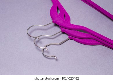 Clothes Velvet Hangers On The Grey Background